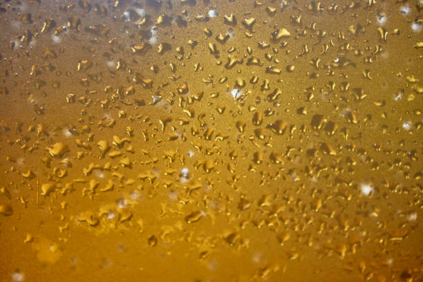 istock Abstract water drops on yellow transparent background 1404170319