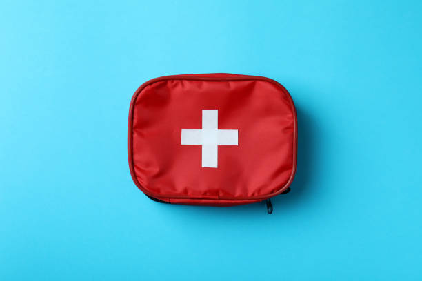 istock First aid medical kit on blue background 1404170353