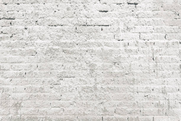 istock Texture of old brick wall sprayed with stucco mortar as background 1404173516