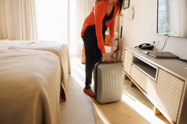 istock Arrival in hotel room with hand luggage 1404174783