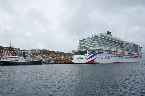 The Norwegian port of Stavanger, Norway, Europe. The P&O cruise liner Iona is moored in the background.