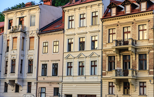 Old fashioned buildings with two or three floors in a row in historical part of Ljubljana
