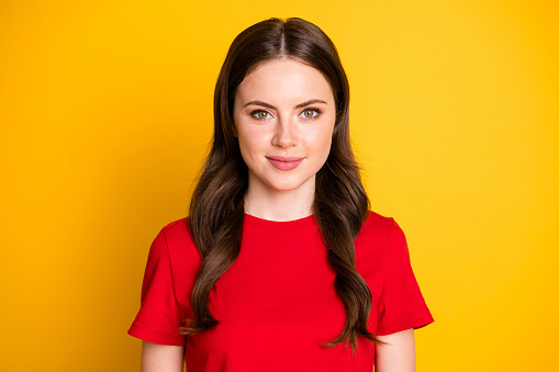 Closeup photo of attractive lady good mood wear casual red t-shirt top isolated vibrant shine yellow color background.