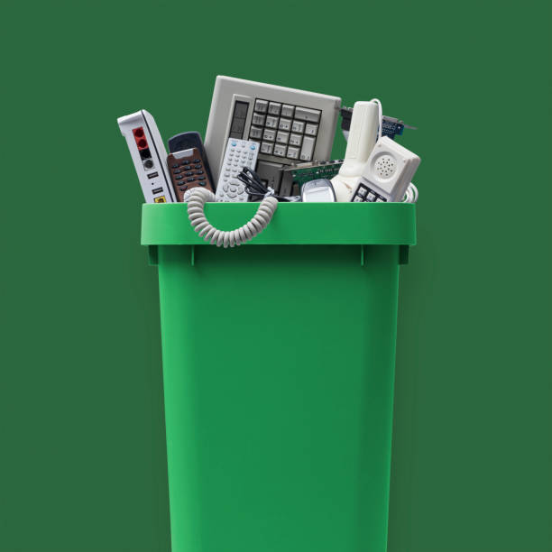 Waste bin full of e-waste stock photo