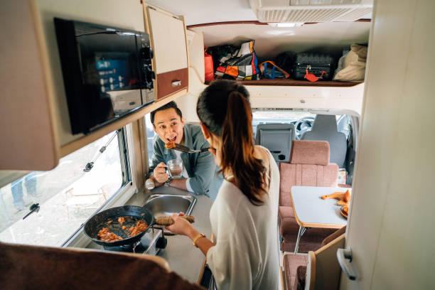 istock Asian Chinese family enjoy holiday in front motor home campervan 1404178708