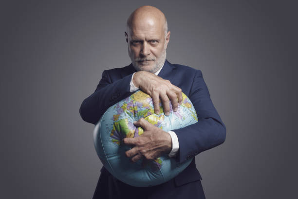 istock Greedy corporate businessman crushing and exploiting earth 1404178801