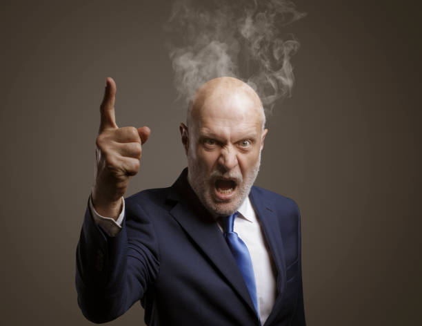 istock Angry furious boss shouting at camera 1404178885