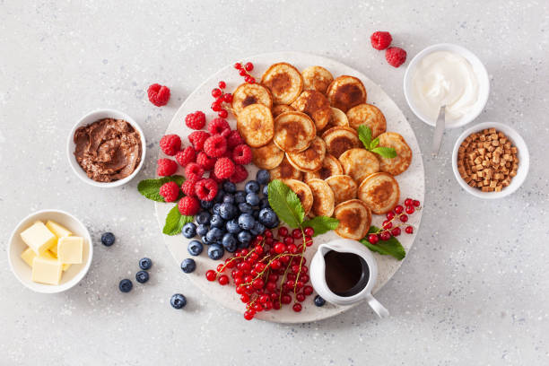 istock american mini pancake board with berries and maple syrup 1404179534