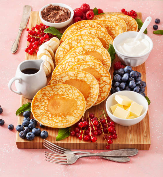 istock american pancake board with berries maple syrup butter 1404179595