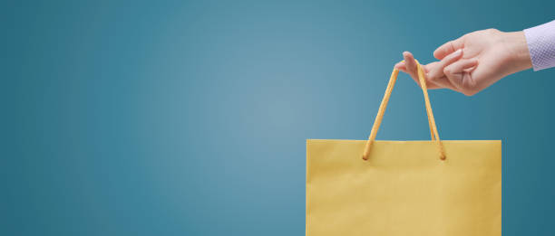 istock Woman holding a shopping bag 1404179669