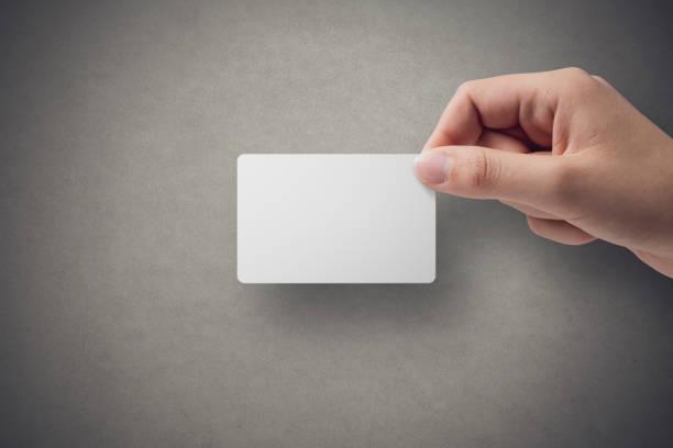 Hand holding a blank business card