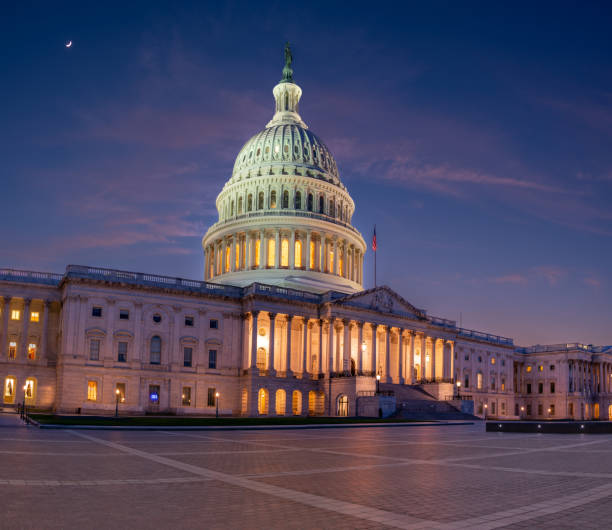 istock Side Profile of the US Capitol At Sunset With Empty Square 1404181380
