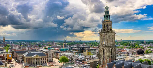 Panoramic view over the city of Groningen in The Netherlands from the Forum cultural center with a dramatic sky above.