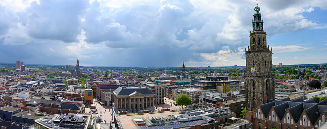 Panoramic view over the city of Groningen in The Netherlands from the Forum cultural center with a dramatic sky above.