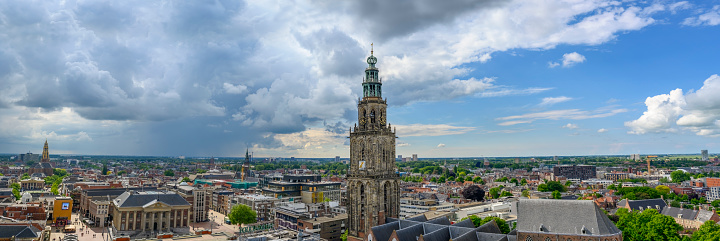 Panoramic view over the city of Groningen in The Netherlands from the Forum cultural center with a dramatic sky above.