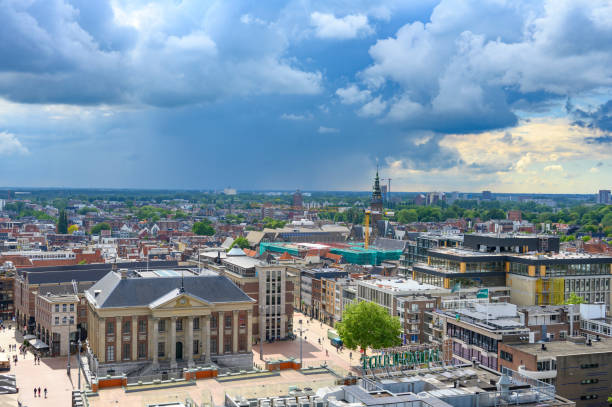 Panoramic view over the city of Groningen in The Netherlands from the Forum cultural center with a dramatic sky above.