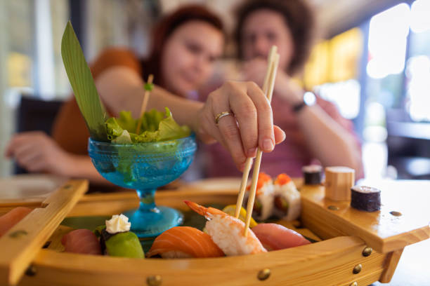 istock Front view of couple dining sushi 1404182504