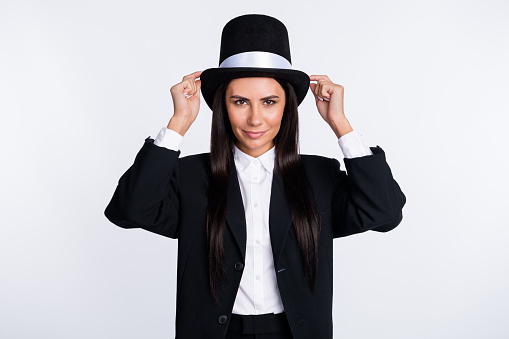 Photo of happy lovely smiling charming woman magician sorcerer with hat cylinder isolated on white color background.