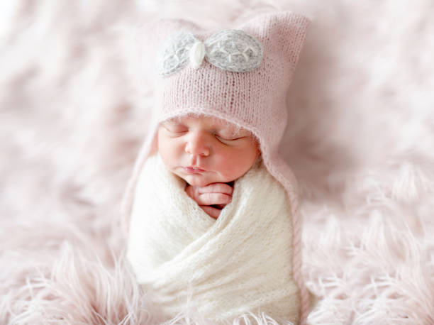 istock Newborn in beanie hat on a shaggy carpet 1404182777