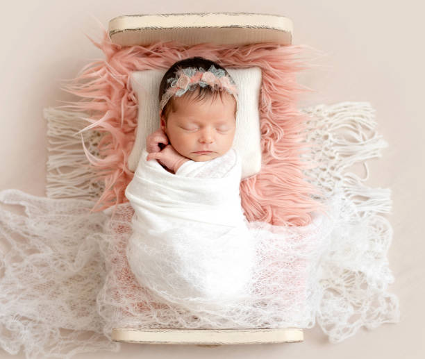 istock newborn sleeping on baby bed 1404182801