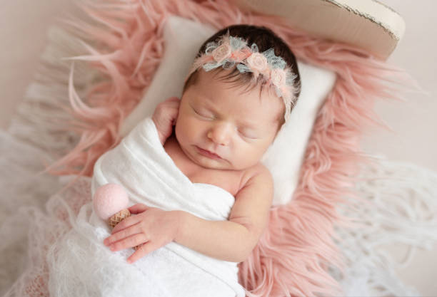 istock newborn sleeping on baby bed 1404182805