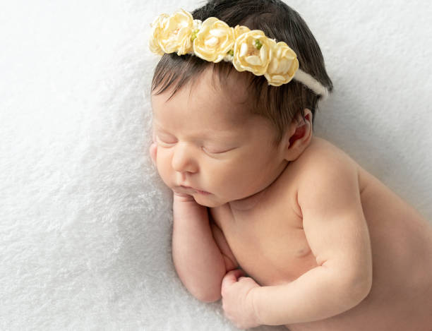 istock Newborn baby sleepin on tummy 1404182826