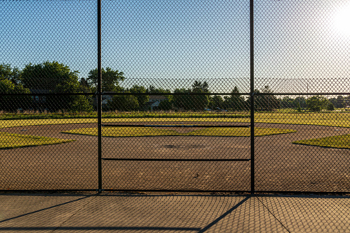 infield of a baseball diamond in the early morning