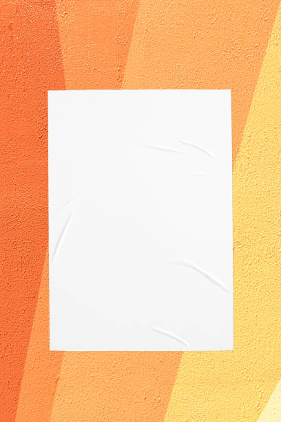 istock orange yellow urban wall with glued poster 1404185737