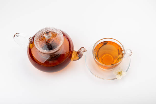 istock Composition with cup of jasmine tea and flowers on light background 1404185804