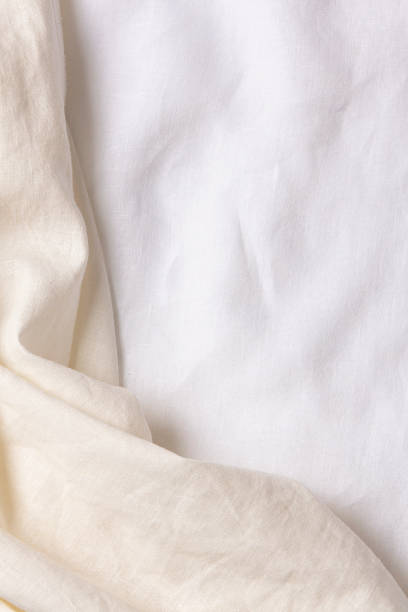 istock White crumpled linen fabric texture background. Natural linen organic eco textiles canvas background. Top view 1404185844