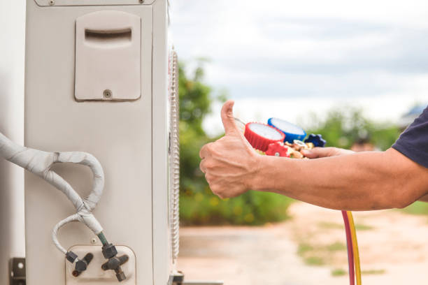 istock Technician checking the operation of the air conditioner 1404189180