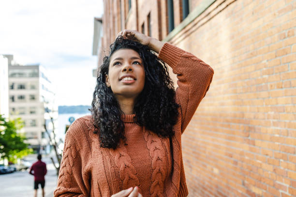 Portrait of a charming young African-American woman with curly hair