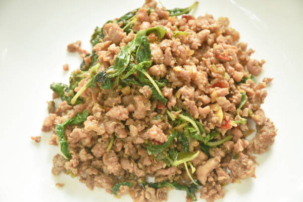 istock spicy stir fried chop pork with chili and basil leaf 1404196173