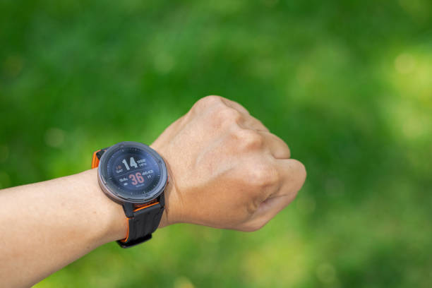 istock Men hands wearing the smart watch 1404196923