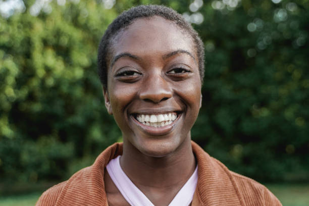 istock Happy African bald girl smiling on camera - Focus on face 1404197120