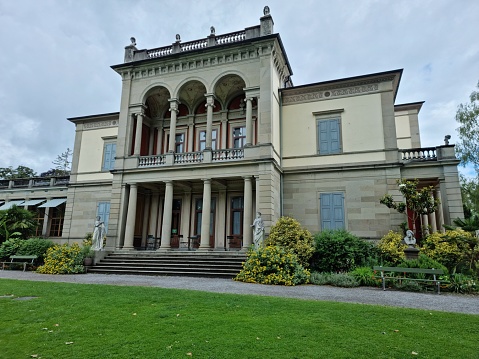 The Villa Wesendonck planned by Leonhard Zeugheer and realized between 1853–1857 for the Family Wesendonck. The Villa is located inside the beautiful Rietbergpark in the Enge District of Zurich City. The Building is part of the Rietbermuseum which is displaying Asian, African, American and Oceanian art. The image was captured during springtime.