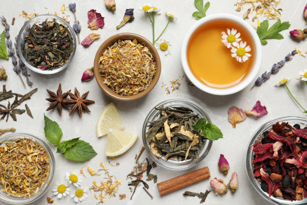 istock Flat lay composition with fresh brewed tea and dry leaves on light table 1404197279
