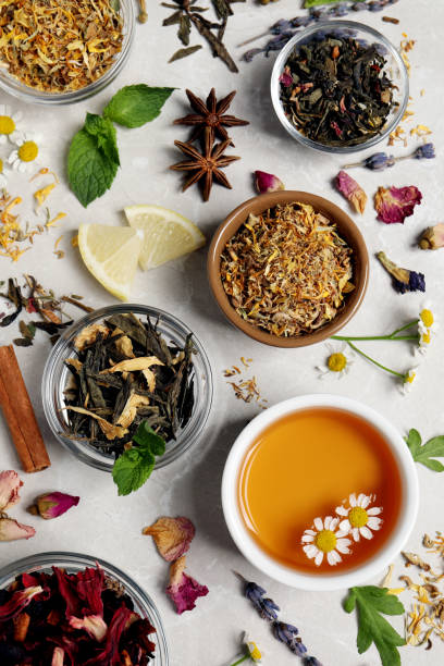 istock Flat lay composition with fresh brewed tea and dry leaves on light table 1404198508