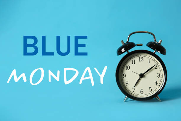 istock Alarm clock and text Blue Monday on color background 1404198622
