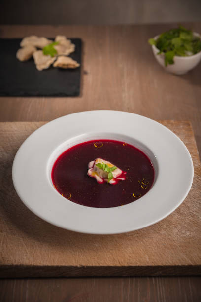 istock Christmas beetroot soup, red borscht with small dumplings with mushroom filling 1404199667
