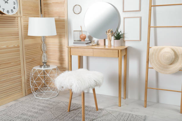 istock Modern wooden dressing table with mirror and stool in room 1404200471