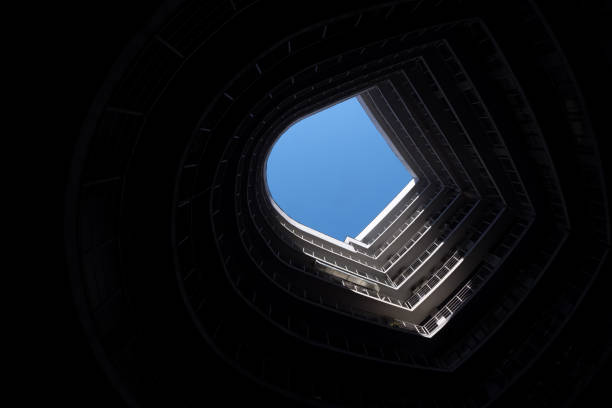istock Abstract building architecture background urban concept. Modern urban architecture circle building office exterior background blue black art. Low angle building curve architecture abstract urban view 1404200900