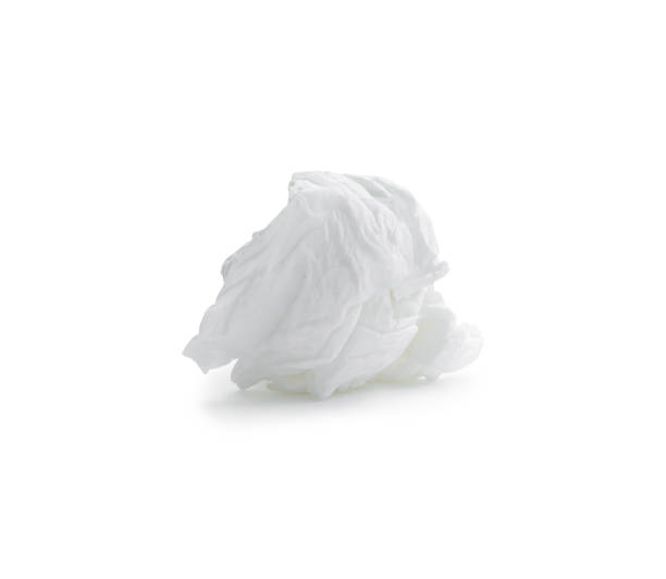 istock Single screwed or crumpled tissue paper or napkin after use isolated on white background with clipping path 1404200984