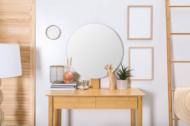 istock Modern wooden dressing table with mirror and decorative elements in room 1404202171