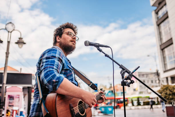 istock Guitar Player On A City Square 1404202215