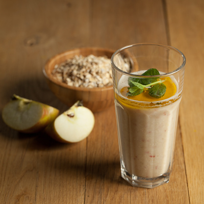 Healthy oat and apple smoothie with linen oil and minth