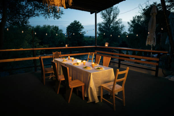 Decorated dinning table, at the romantic restaurant near river, during night