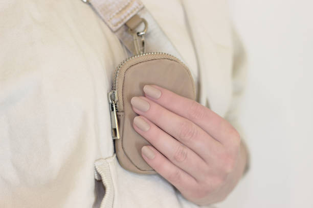 istock beige matte long false nails on one hand close-up 1404203989