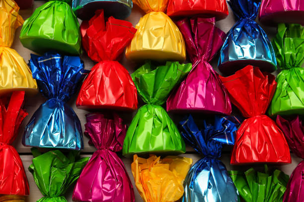 istock Candies in colorful wrappers as background, closeup 1404206326