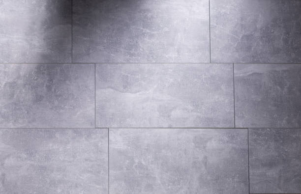 istock Grey laminate or tile background on floor texture. Gray flooring laminate top view 1404212779